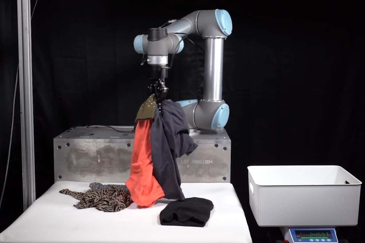 AI cleansing robotic can tidy up garments in a messy bed room