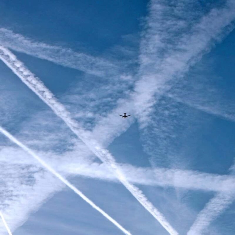 Jet contrails may cool the planet by day and warm it by night