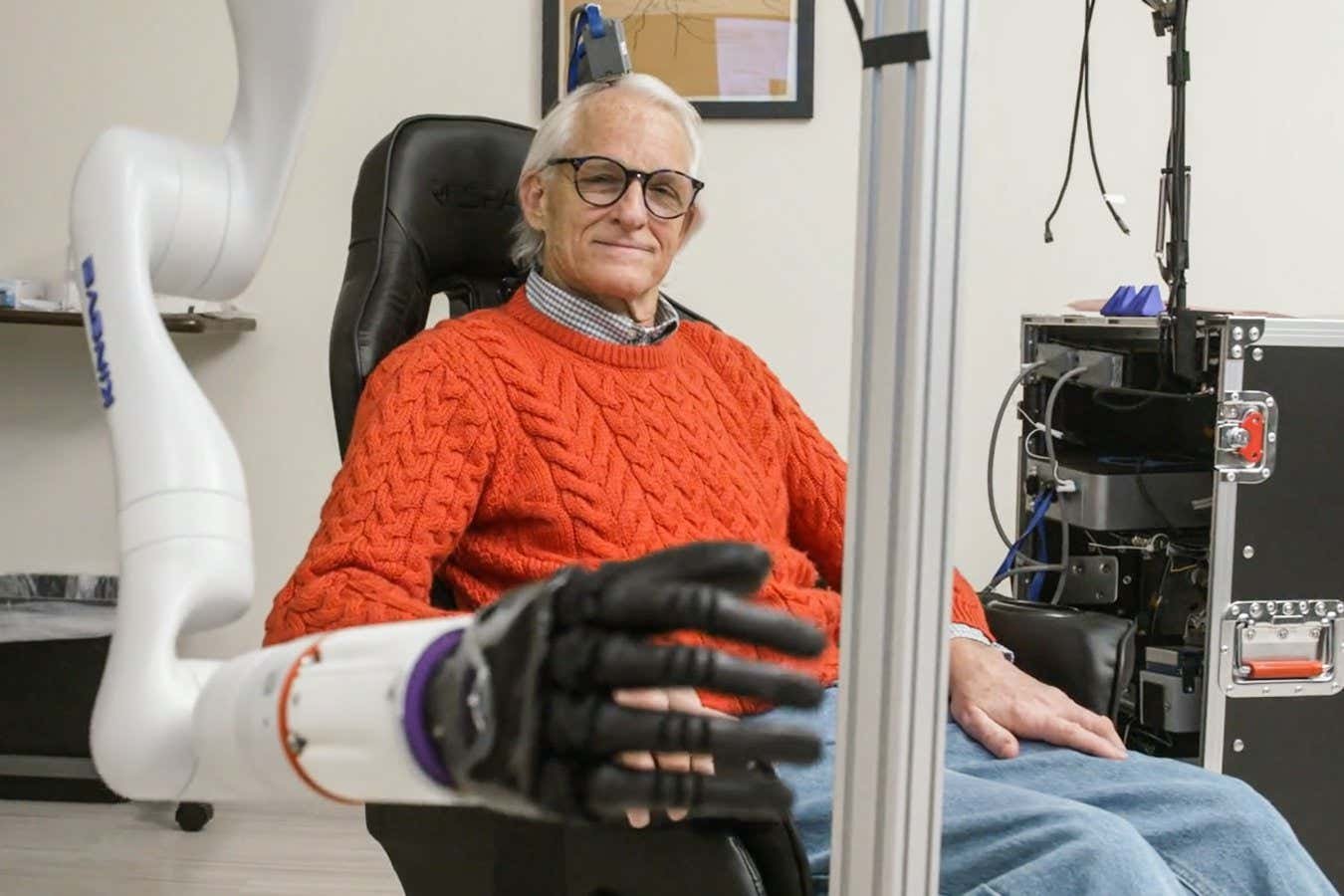 Mind-controlled robotic arm lets people with paralysis touch and feel